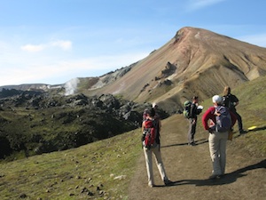 Students hiking across an Icelandic lava field during the Iceland Volcanology Field Camp