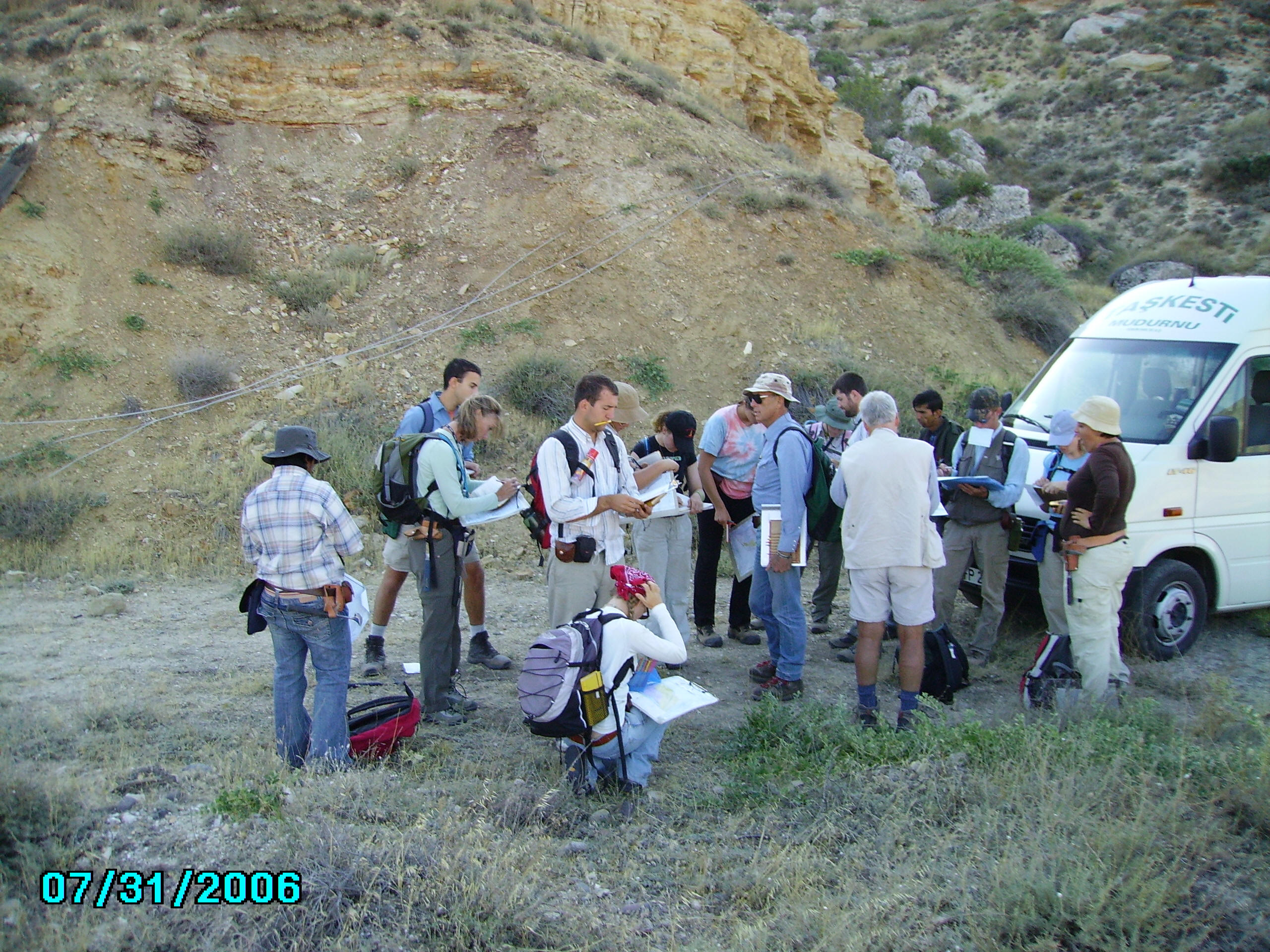 Students examining structural geology during field camp session