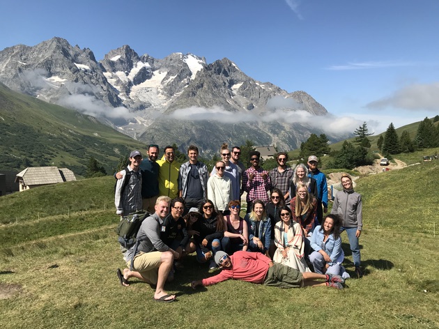 Field camp participants examining Alpine geological structures in the French Alps