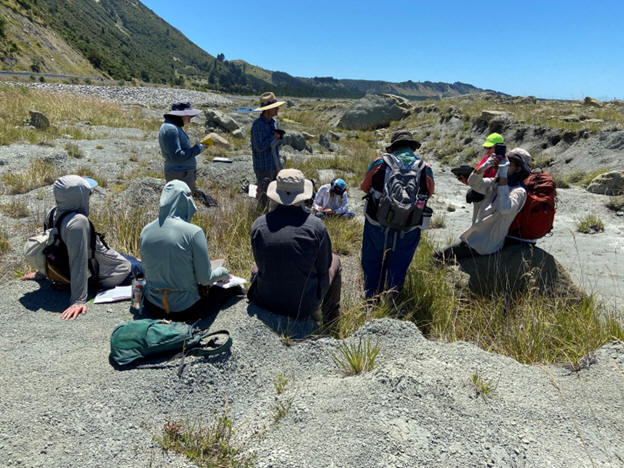 Students examining carbonate outcrops on New Zealand's South Island